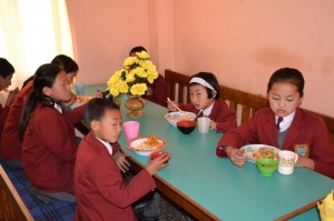 Children dining at their SCEF-supported hostel